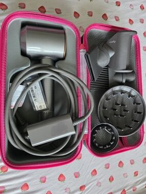 Dyson Copper and Nickel hair dryer with pink travel case and 5 attachments